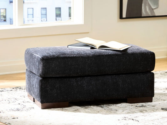 Whitmore Manor - Ottoman - Black Pearl Upholstered Ottomans by Benchcraft® - Walls Furniture & Mattress