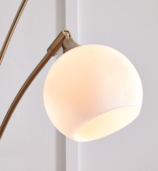Taliya - Metal Arc Lamp - Champagne / White Floor Lamps by Signature Design by Ashley® - Walls Furniture & Mattress