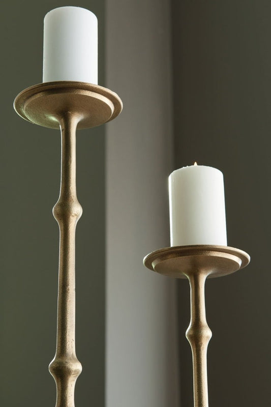 Larwick - Candle Holder Set (Set of 2) - Antique Brass Finish Candles & Holders by Signature Design by Ashley® - Walls Furniture & Mattress