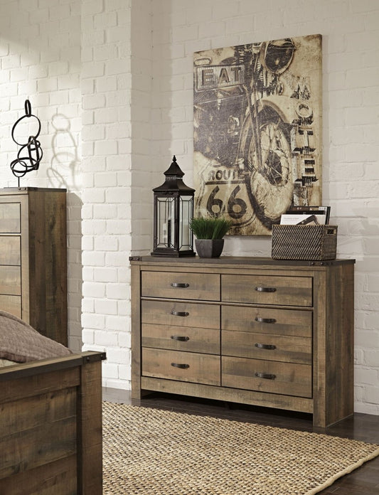 Trinell - Six Drawer Dresser - 61.34" x 15.98" x 42.99" - Brown Dark Dressers by Signature Design by Ashley® - Walls Furniture & Mattress