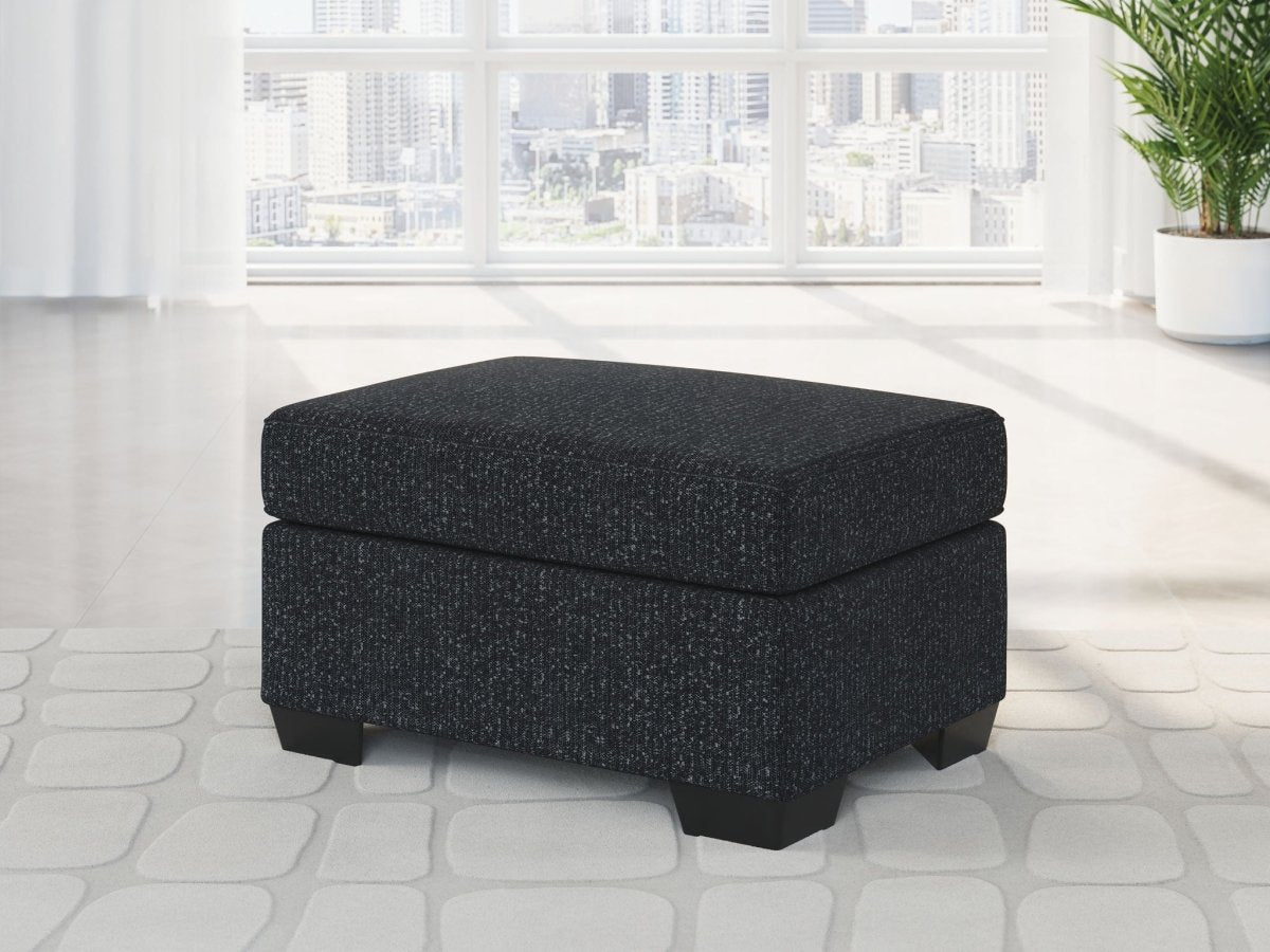 Jasmine Peaks - Ottoman - Coal Upholstered Ottomans by Benchcraft® - Walls Furniture & Mattress