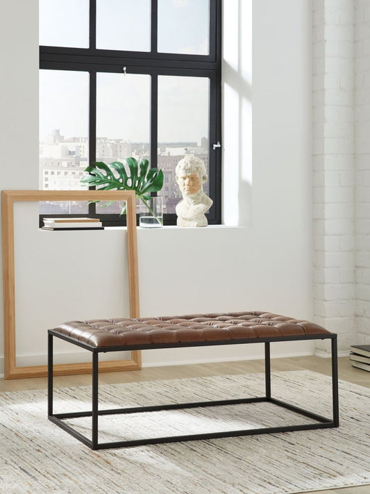 Junsor - Cocktail Ottoman - Brown / Black Coffee Table Ottomans by Signature Design by Ashley® - Walls Furniture & Mattress