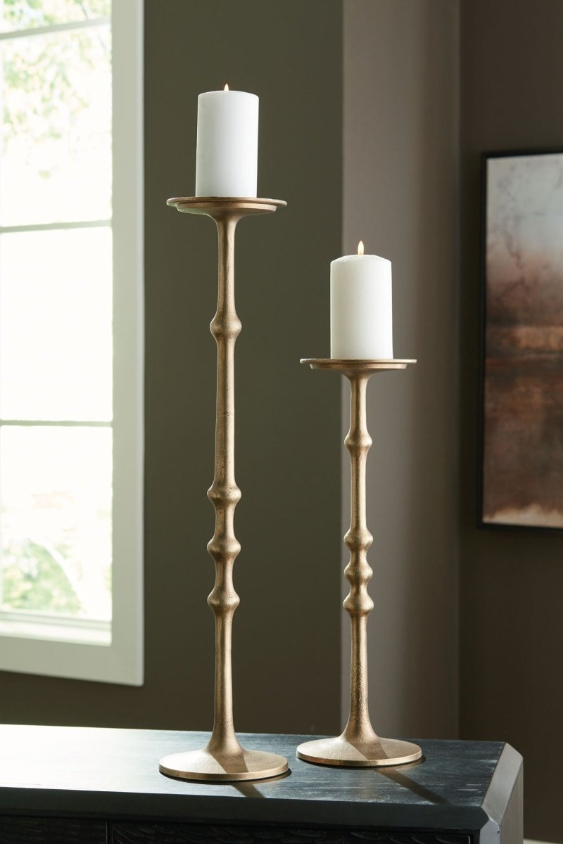 Larwick - Candle Holder Set (Set of 2) - Antique Brass Finish Candles & Holders by Signature Design by Ashley® - Walls Furniture & Mattress