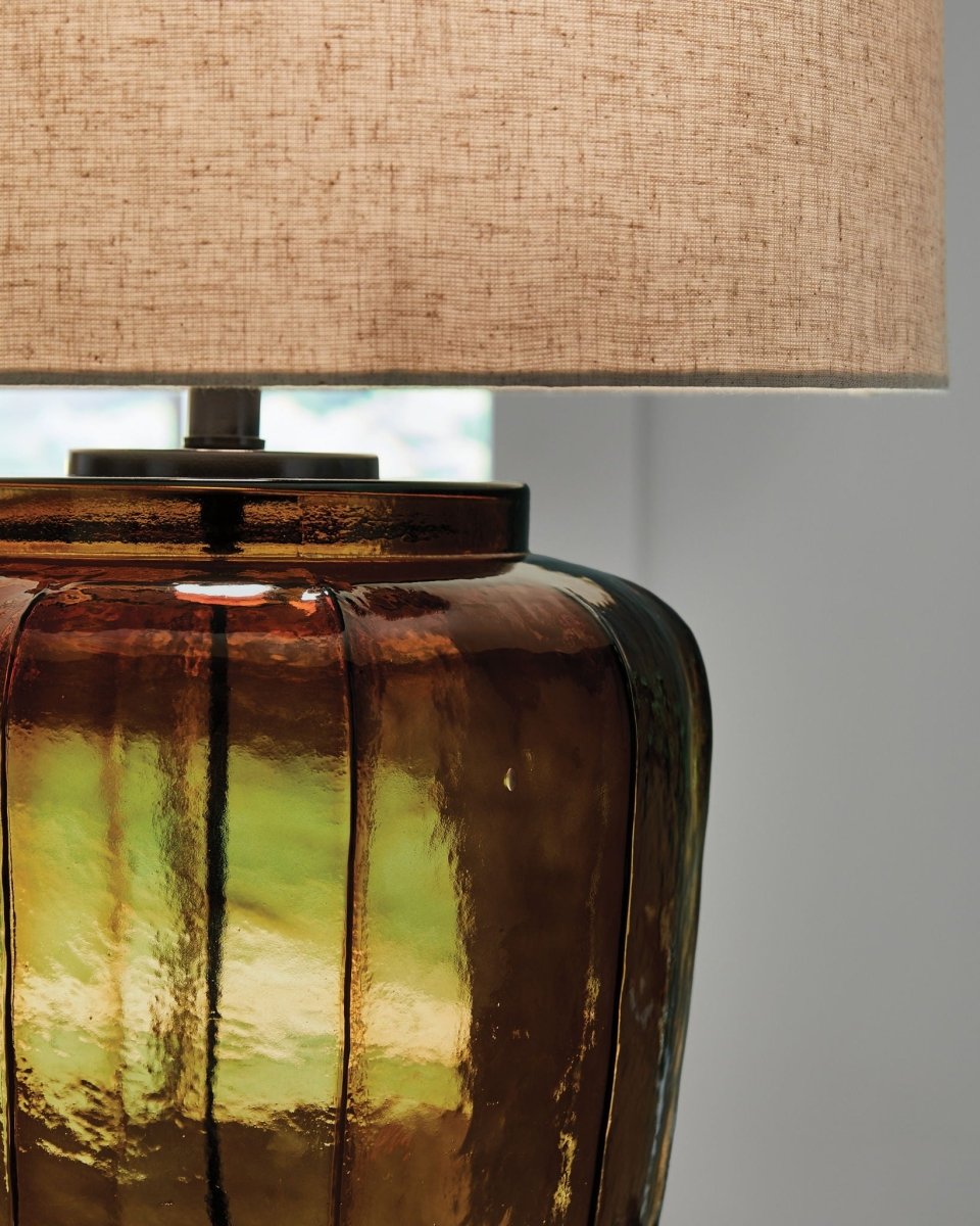 Bainmore - Amber - Glass Table Lamp Table Lamps by Signature Design by Ashley® - Walls Furniture & Mattress