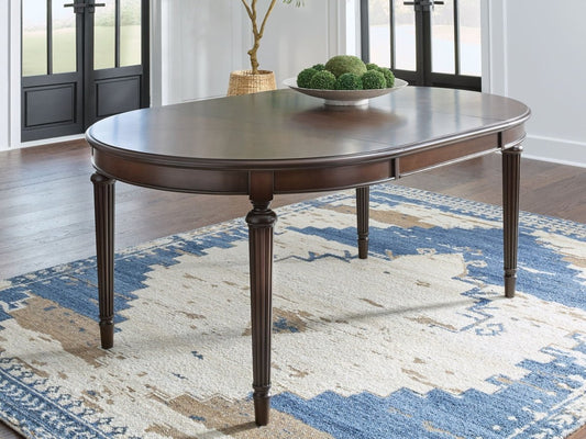 Lavinton - Oval Dining Room Extension Table - Brown Dining Tables with Extensions by Signature Design by Ashley® - Walls Furniture & Mattress