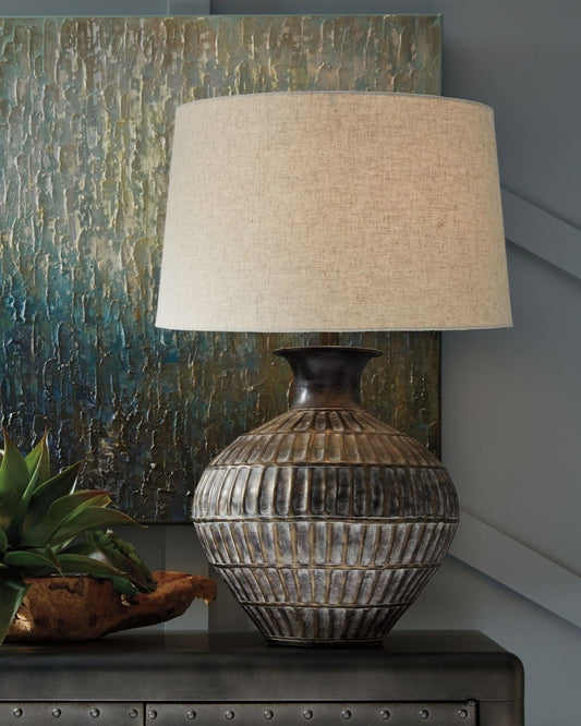 Magan - Metal Table Lamp - Antique Bronze Finish Table Lamps by Signature Design by Ashley® - Walls Furniture & Mattress