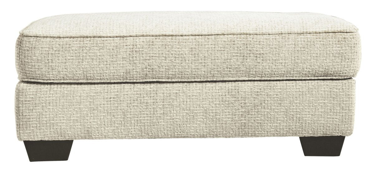 Monaghan - Ottoman - Sandstone Upholstered Ottomans by Signature Design by Ashley® - Walls Furniture & Mattress
