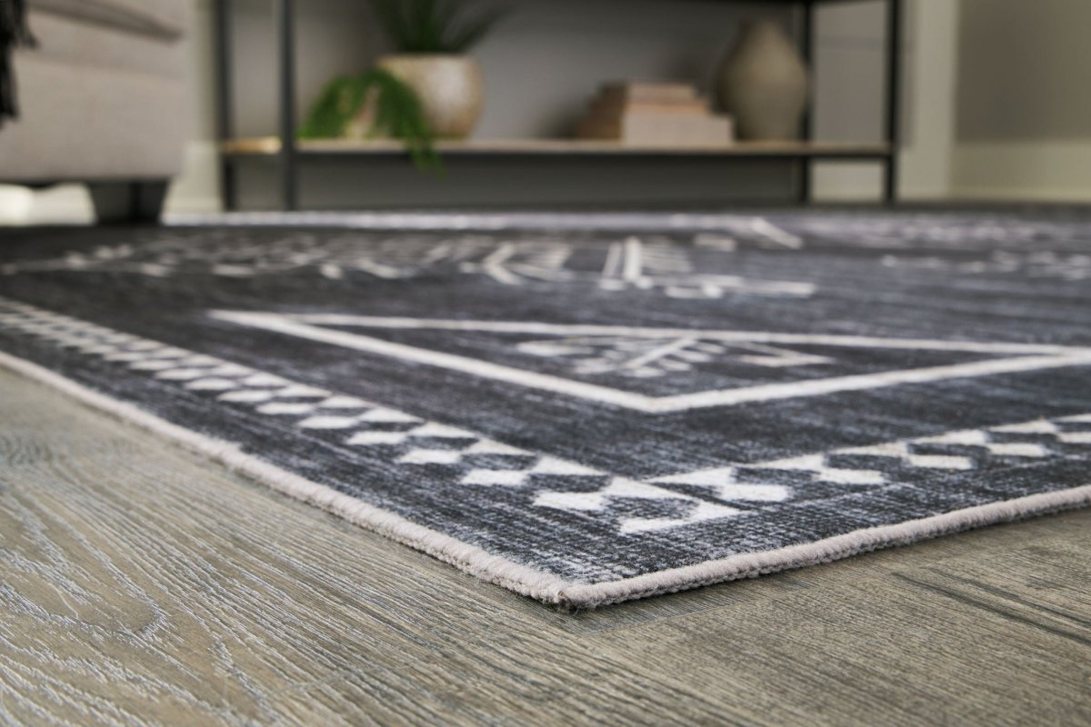 Arloman - Area Rug Washable Rugs by Signature Design by Ashley® - Walls Furniture & Mattress