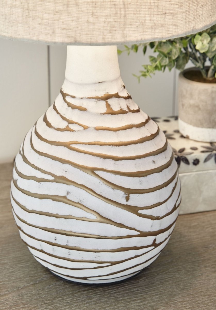 Aleela - Metal Table Lamp - White / Gold Finish Table Lamps by Signature Design by Ashley® - Walls Furniture & Mattress