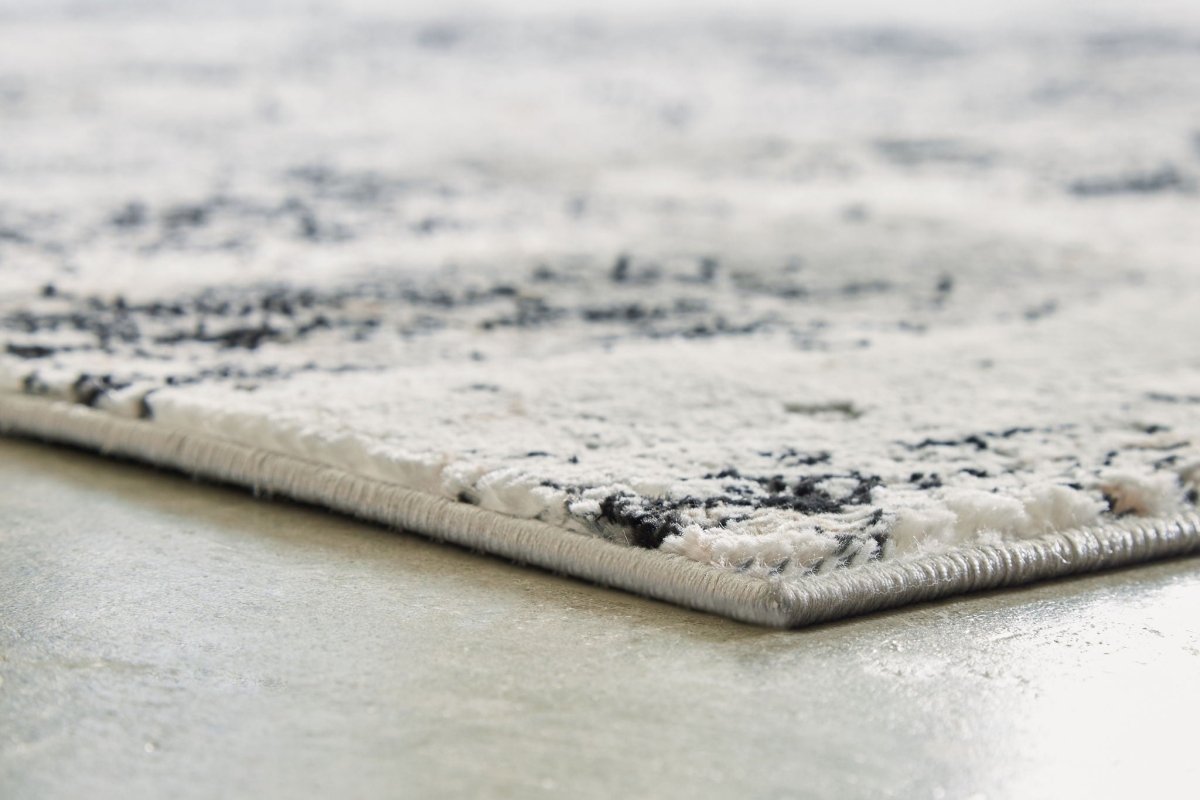 Langwell - Rug Area Rugs by Signature Design by Ashley® - Walls Furniture & Mattress