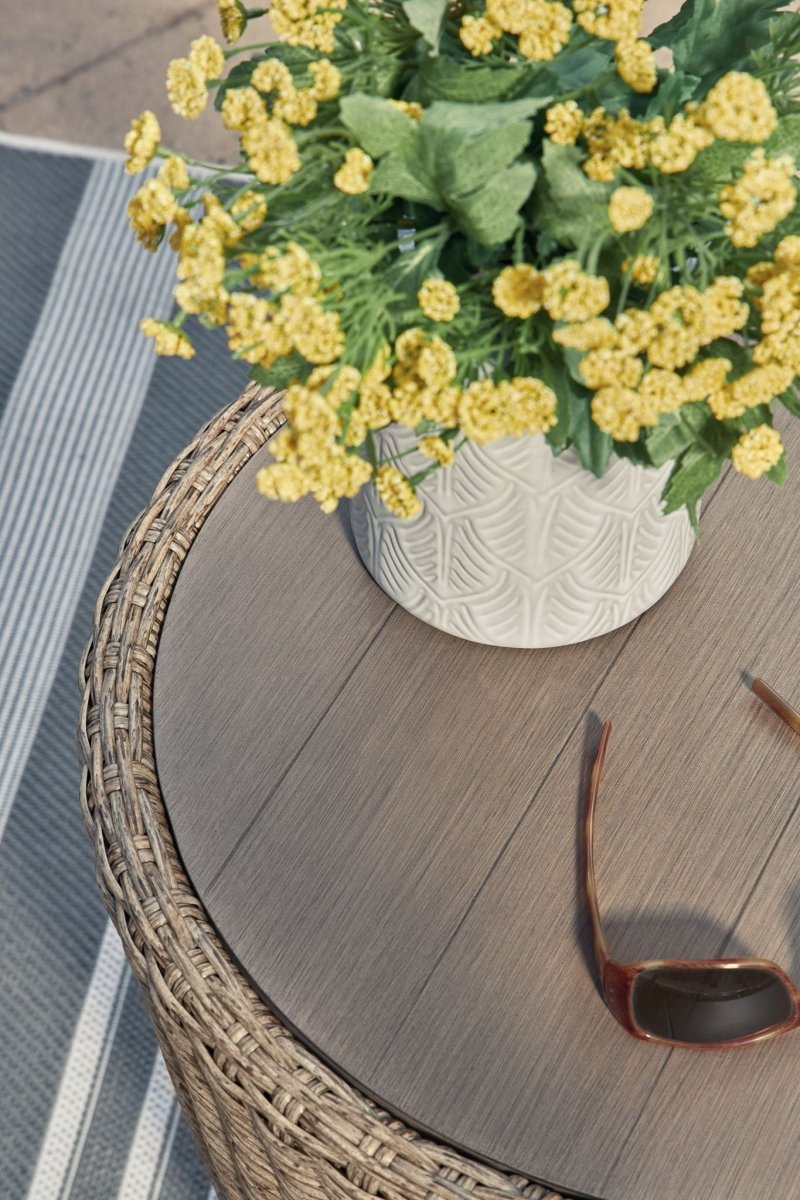 Danson - Round End Table - Beige End Tables by Signature Design by Ashley® - Walls Furniture & Mattress