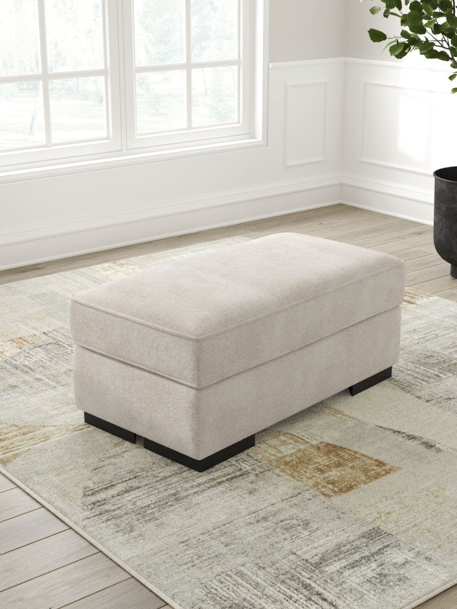 High Profile - Ottoman - Taupe Upholstered Ottomans by Benchcraft® - Walls Furniture & Mattress