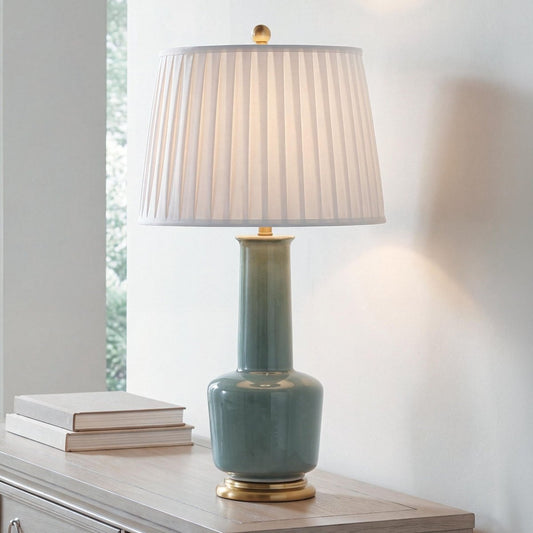 Webbington - Ceramic Table Lamp - Teal / Gold Finish Table Lamps by Signature Design by Ashley® - Walls Furniture & Mattress