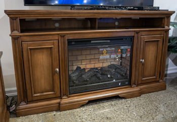 Channley - XL TV Stand With Fireplace Option - Brown TV Stands by Signature Design by Ashley® - Walls Furniture & Mattress
