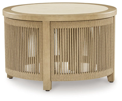 Spooners Cove - Round Cocktail Table - Beige Coffee Tables by Signature Design by Ashley® - Walls Furniture & Mattress