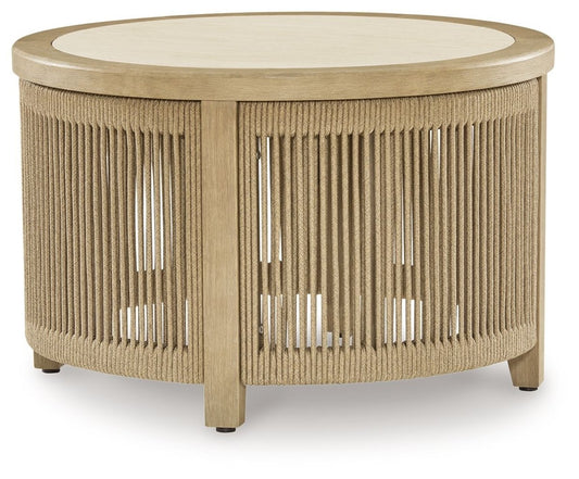 Spooners Cove - Round Cocktail Table - Beige Coffee Tables by Signature Design by Ashley® - Walls Furniture & Mattress