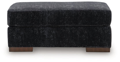 Whitmore Manor - Ottoman - Black Pearl Upholstered Ottomans by Benchcraft® - Walls Furniture & Mattress