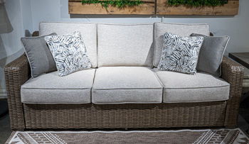 Laguna Heights - Beige - Sofa With Cushion Sofas by Signature Design by Ashley® - Walls Furniture & Mattress