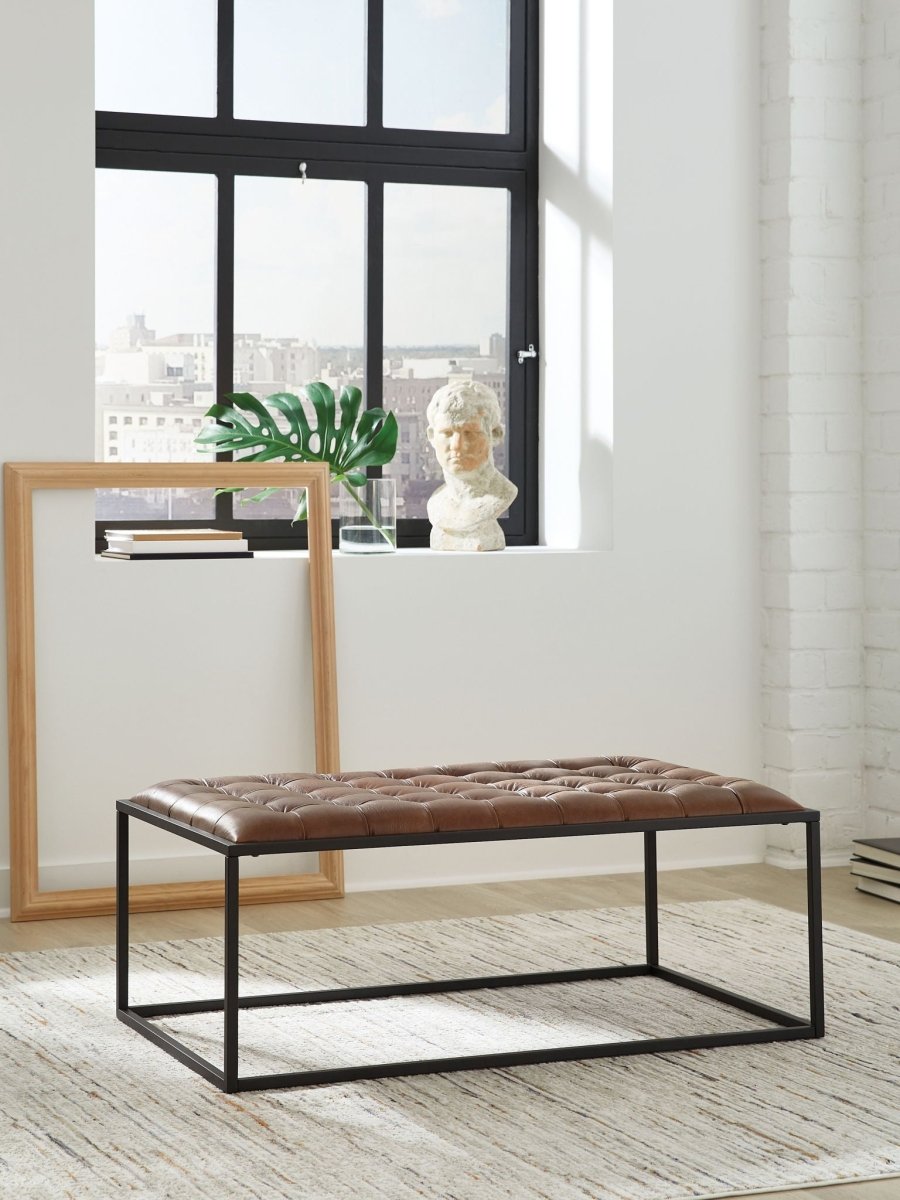 Junsor - Cocktail Ottoman - Brown / Black Coffee Table Ottomans by Signature Design by Ashley® - Walls Furniture & Mattress