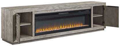 Naydell - 92" TV Stand With Wide Fireplace Insert - Gray Fireplace TV Stands by Signature Design by Ashley® - Walls Furniture & Mattress