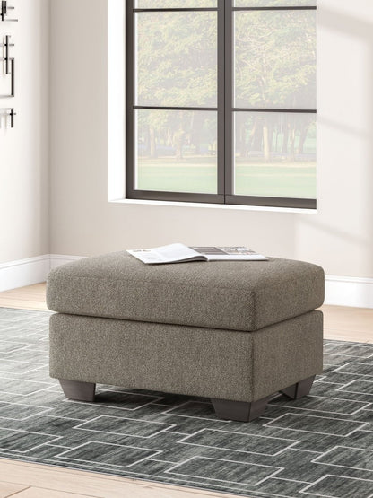 Triston - Peaks - Ottoman - Suede Upholstered Ottomans by Benchcraft® - Walls Furniture & Mattress