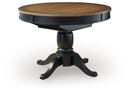 Clorazi - Oval Dining Room Butterfly Extension Table - Black / Brown Dining Tables with Extensions by Signature Design by Ashley® - Walls Furniture & Mattress