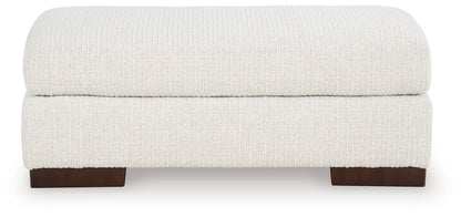Hartside - Ottoman - Frosted Upholstered Ottomans by Benchcraft® - Walls Furniture & Mattress
