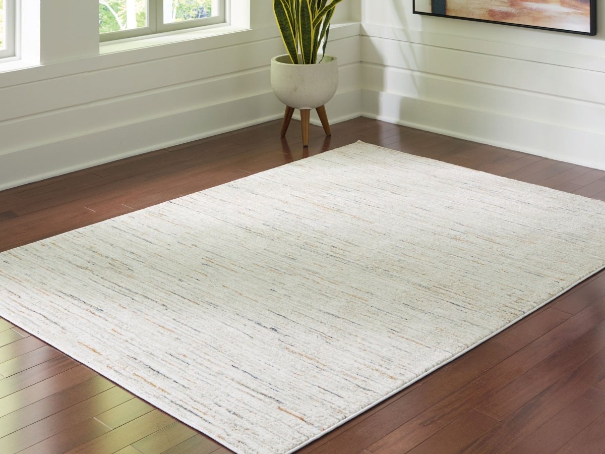 Harjot - Rug Area Rugs by Signature Design by Ashley® - Walls Furniture & Mattress