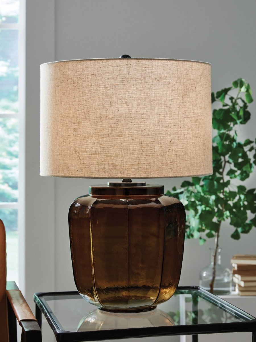 Bainmore - Amber - Glass Table Lamp Table Lamps by Signature Design by Ashley® - Walls Furniture & Mattress