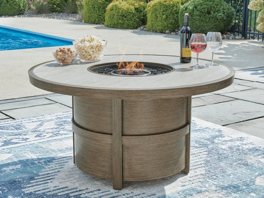 Rainier Ranch - Round Fire Pit Table - Beige Fire Pits by Signature Design by Ashley® - Walls Furniture & Mattress