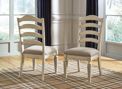 Realyn - Dining UPH Side Chair (Set of 2) - Ladderback - Chipped White Chair Sets by Signature Design by Ashley® - Walls Furniture & Mattress