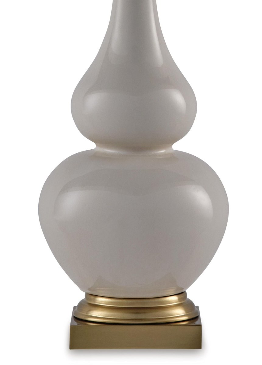 Weswick - Ceramic Table Lamp - Cream / Gold Finish Table Lamps by Signature Design by Ashley® - Walls Furniture & Mattress